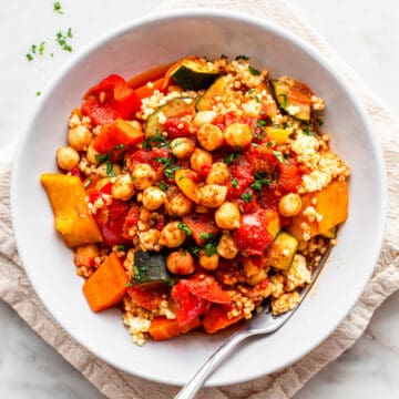 Millet couscous with chickpeas, carrot, zucchini, and bell pepper.
