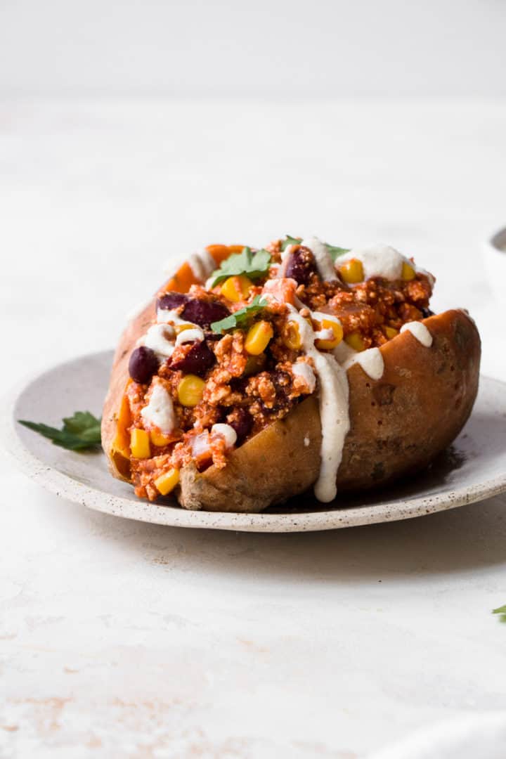 Vegan chilli stuffed sweet potatoes