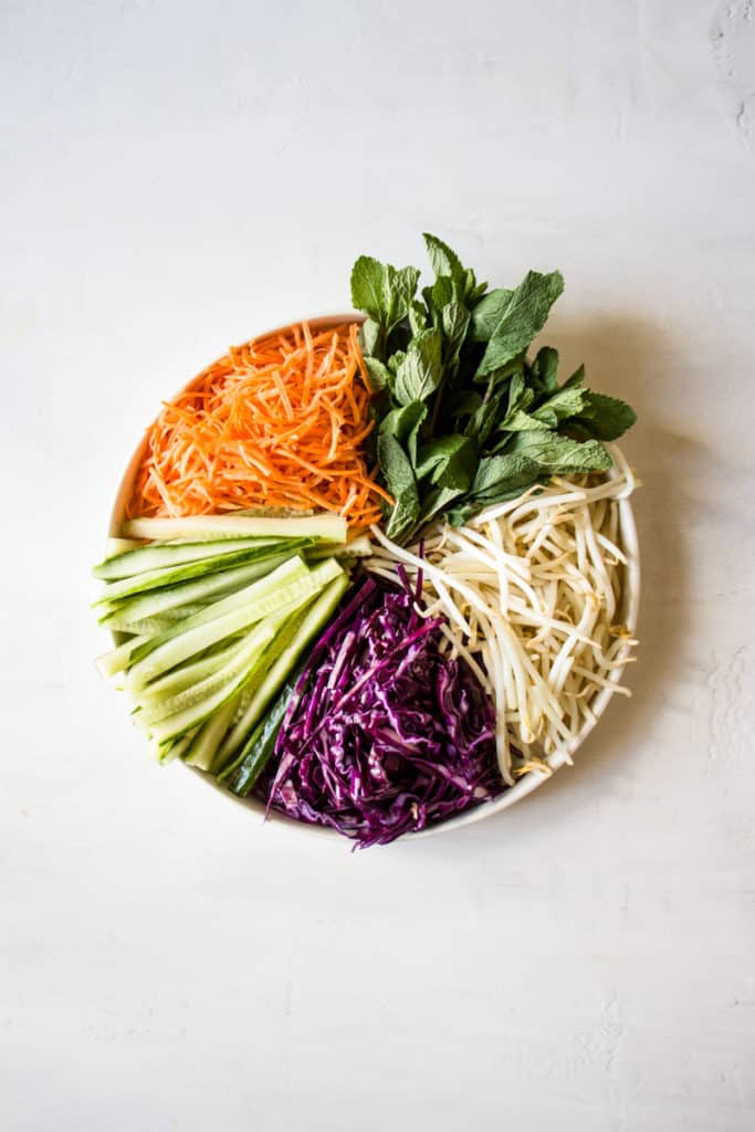 Ingredients for vegan summer rolls on a plate