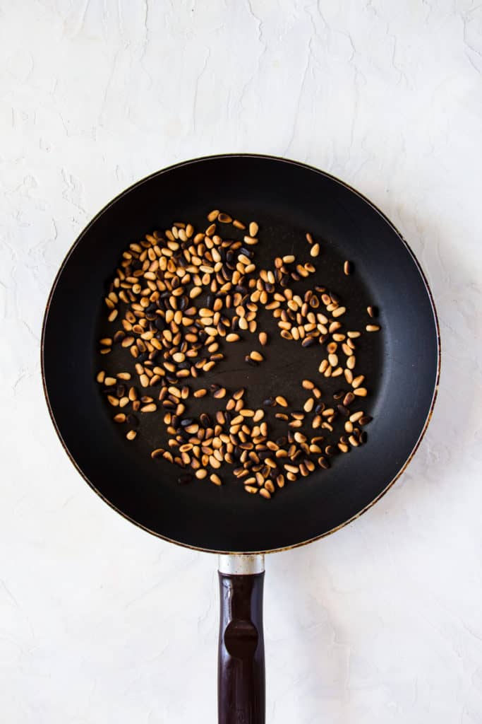 Roasted pine nuts in a pan