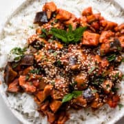 Vegan eggplant curry topped with sesame seeds