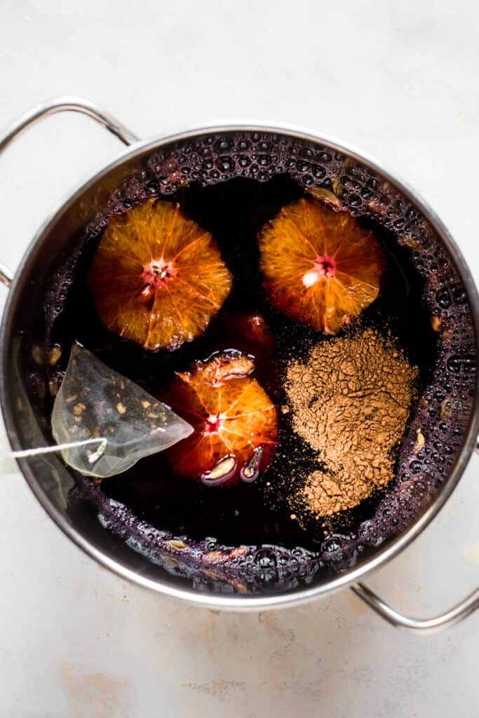 Alcohol free mulled wine cooking on the stove.