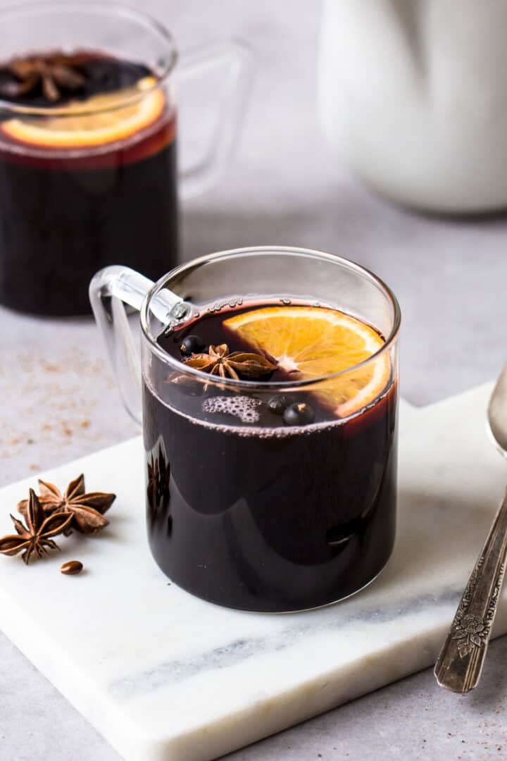 Non alcoholic mulled wine in a glass mug.