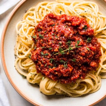 Spaghetti on a plate covered in vegan spaghetti bolognese.