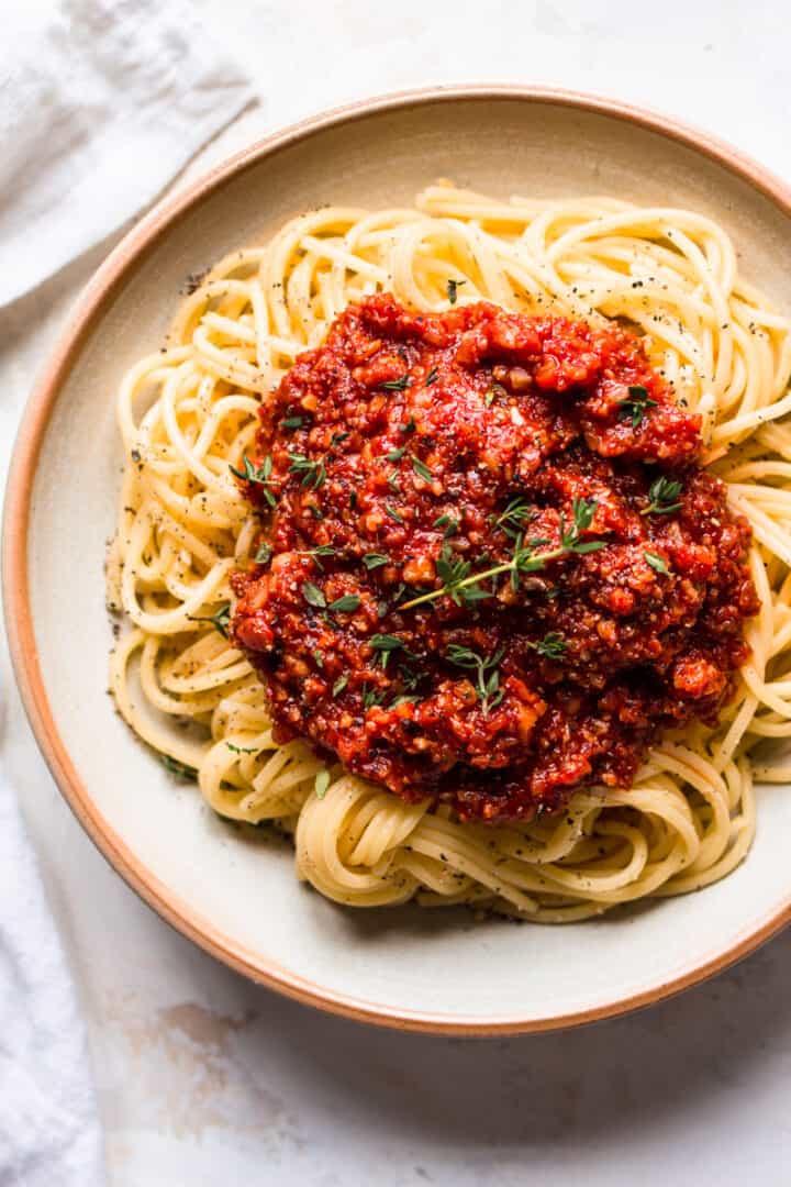 Spaghetti on a plate covered in vegan spaghetti bolognese.