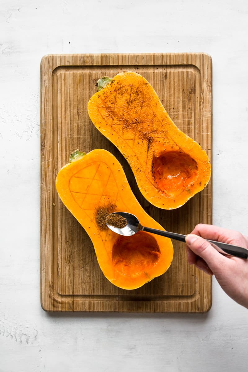 Butternut squash cut in half and rubbed with oil and coconut sugar.