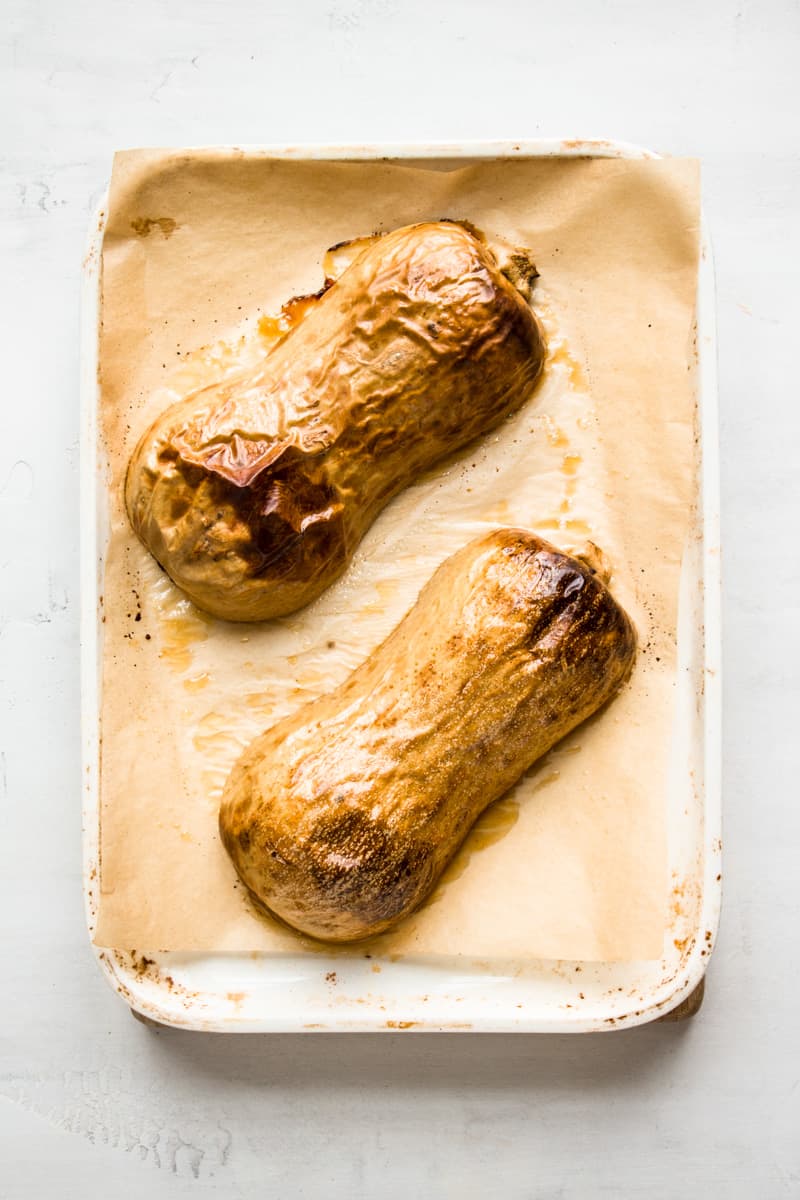 Roasted butternut squash on a baking sheet.