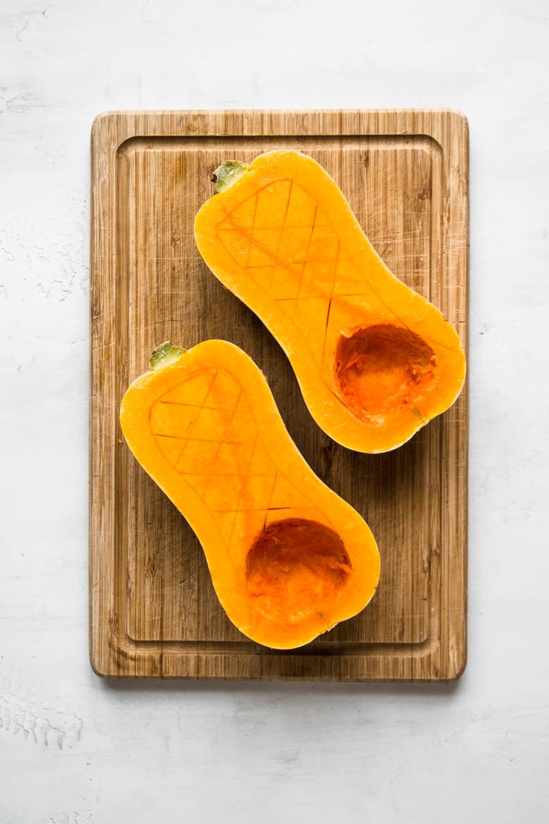 Raw butternut squash cut in half.