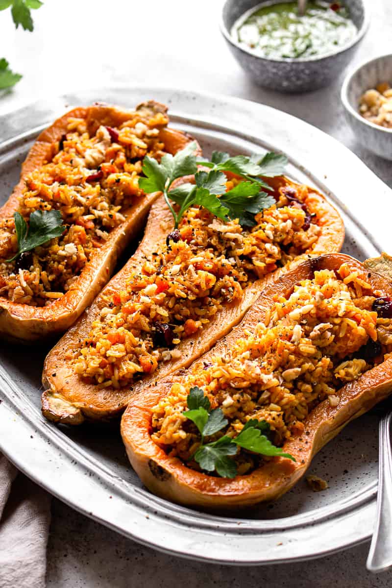 Close up picture of stuffed butternut squash boats.