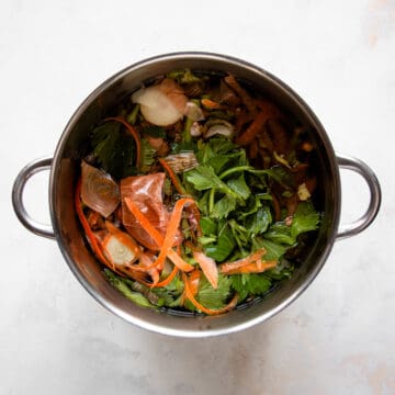 Scraps of vegetables in a large pot.