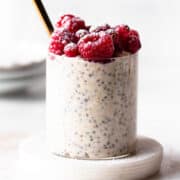 Overnight oats without milk topped with berries and powdered sugar.