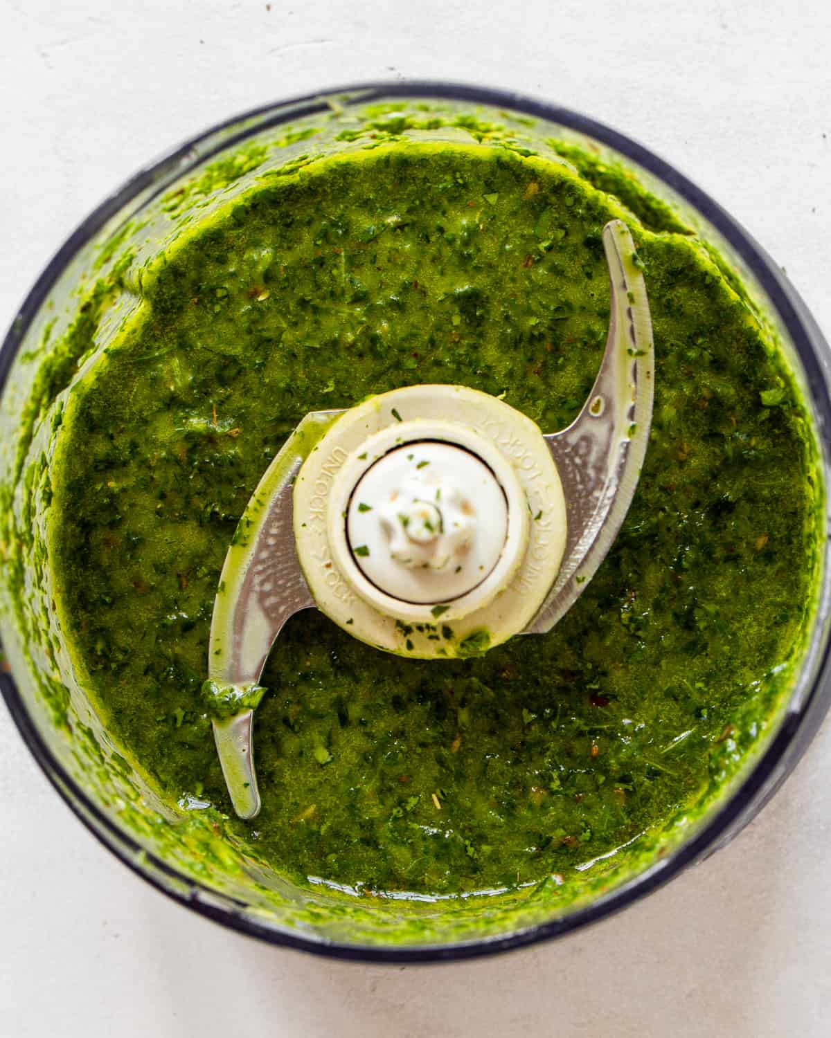 Blended chimichurri in a small food processor.